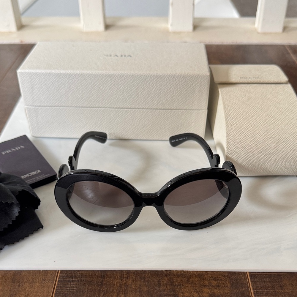 Prada Black Oval Sunglasses with Gradient Lenses